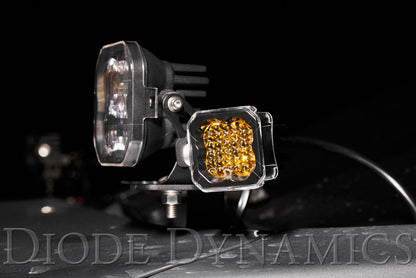 SSC1 LED Pod Cover, Yellow -Motorcycle lights with Diode Dynamics branding on a dark background
